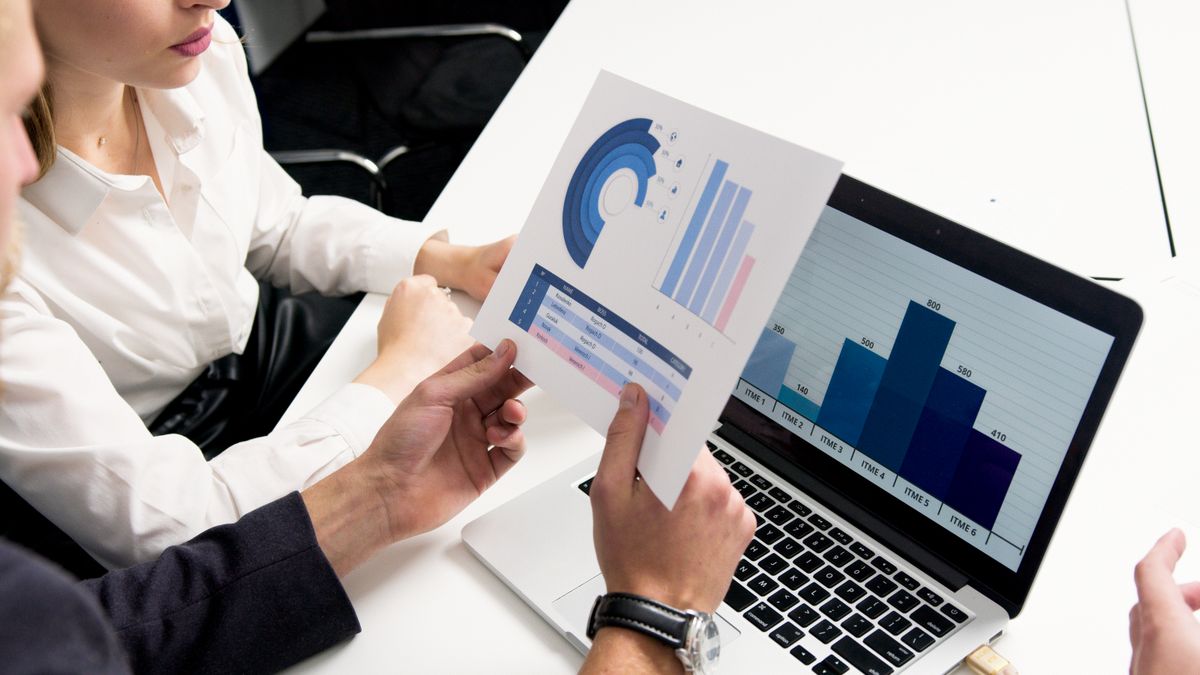 Two notebooks open to a shared money checklist